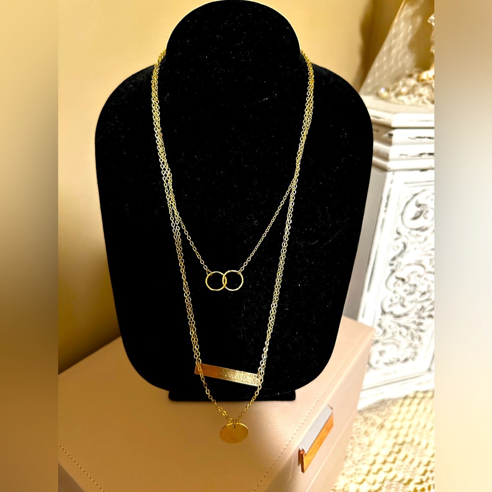 Gold necklace 3 strands held with one lobster clasp
Beautiful and dainty 
NWOT